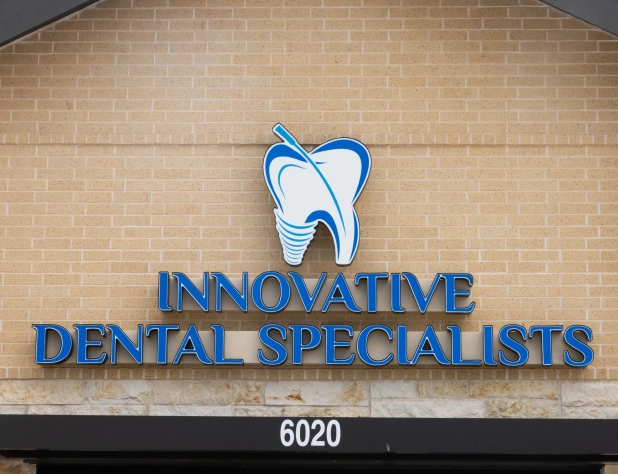 Innovative Dental Specialists storefront sign on brick building at address 6020.